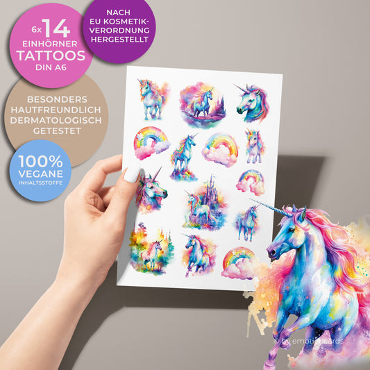 Auf dem Bild ist ein Bogen mit Kindertattoos. Die Tattoos zeigen eine zauberhafte Einhornwelt in einem farbenfrohen Aquarellstil. Die Motive umfassen: Verschiedene Einhörner in verspielten Posen, Regenbögen mit rosa Wolken, Ein märchenhaftes Schloss, Traumhafte Landschaften in leuchtenden Regenbogenfarben. Der Stil ist märchenhaft, bunt und fantasievoll – ideal für Kinder, die Einhörner und Regenbögen lieben.