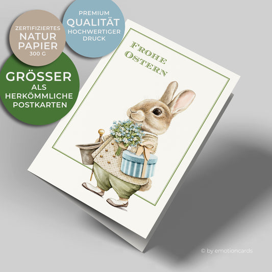 Osterkarte im Hochformat mit feinem grünen Doppelrahmen, Gentleman Osterhase mit Blumenstrauß, Geschenk, Stock und Zylinder