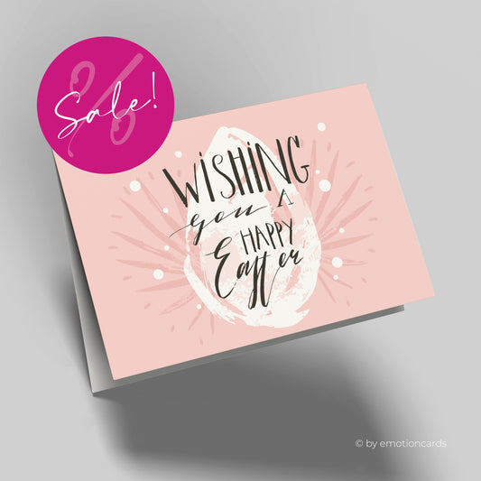 Moderne Osterkarte, rosafarbener Hintergrund und weißes abstraktes Osterei. Wishing you a happy easter als Satz vorne drauf.