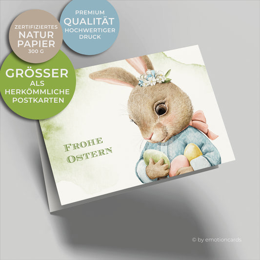 Süße Osterkarte mit kleinem Baby Hasen mit drei farbigen Ostereiern