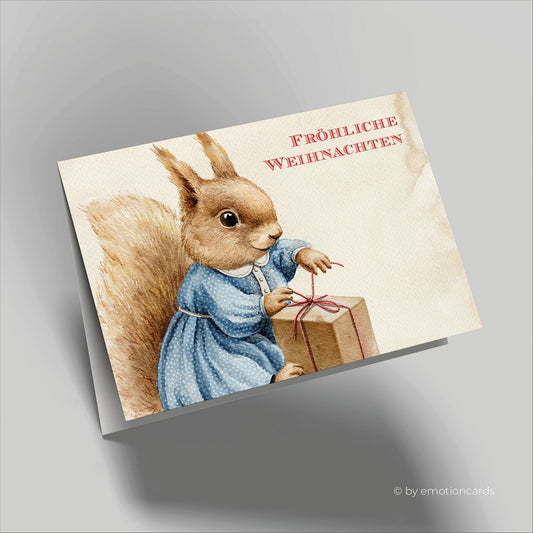 Weihnachtskarte | Süßes Eichhörnchen packt Geschenk aus