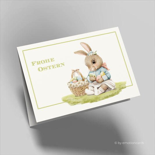 Süße Osterkarte (Klappkarte) | Baby Hase mit Osterkorb und Ostereiern | Premium-Karton | Inkl. Umschlag | Große Karte (115mm x 170mm)
