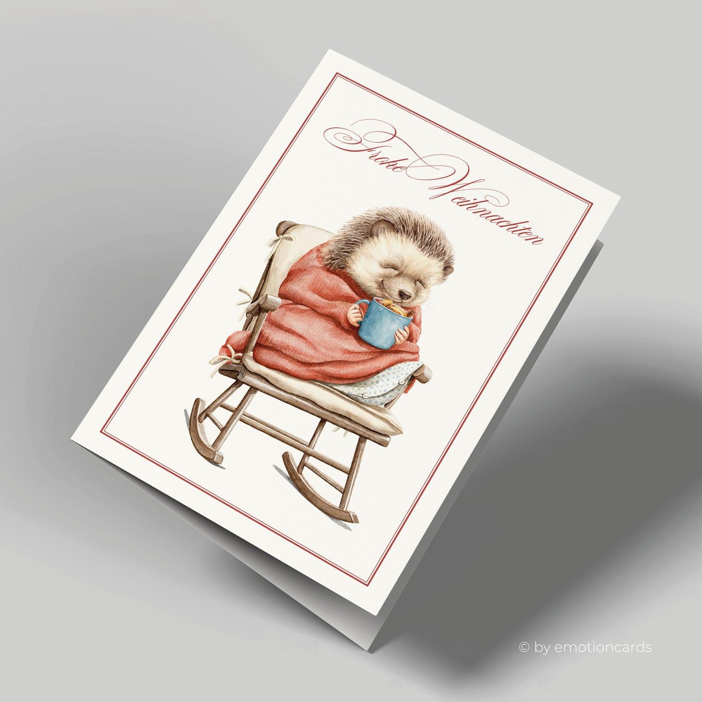 Weihnachtskarte | Igel mit Decke und heißer Schokolade auf Schaukelstuhl