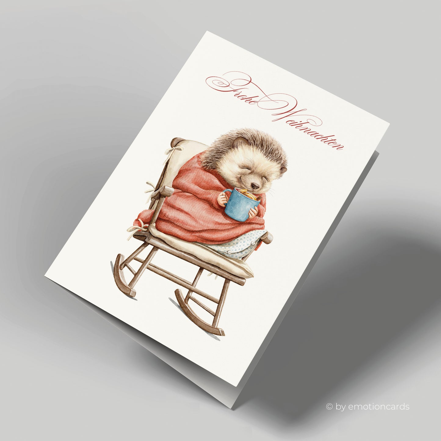 Weihnachtskarte | Igel mit Decke und heißer Schokolade auf Schaukelstuhl
